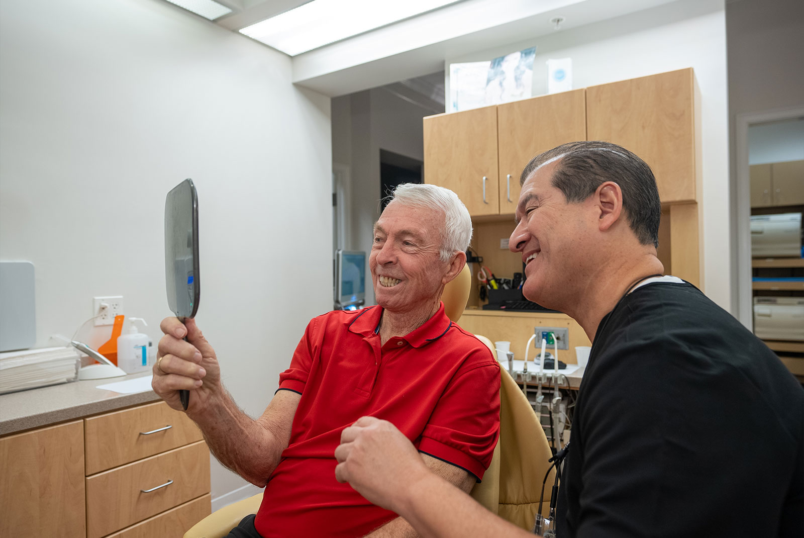 Patient with a brand-new smile after dental implants
