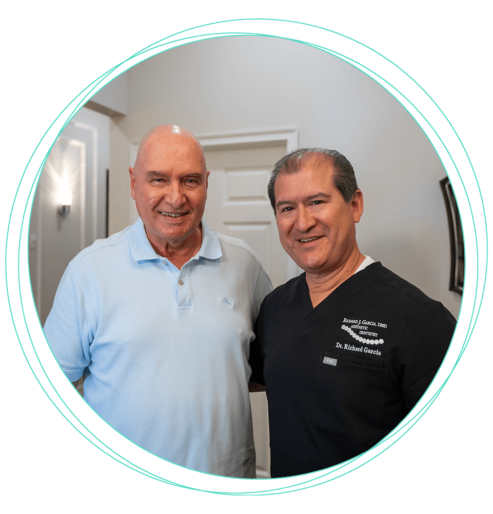 patient and doctor both smiling after dental treatment
