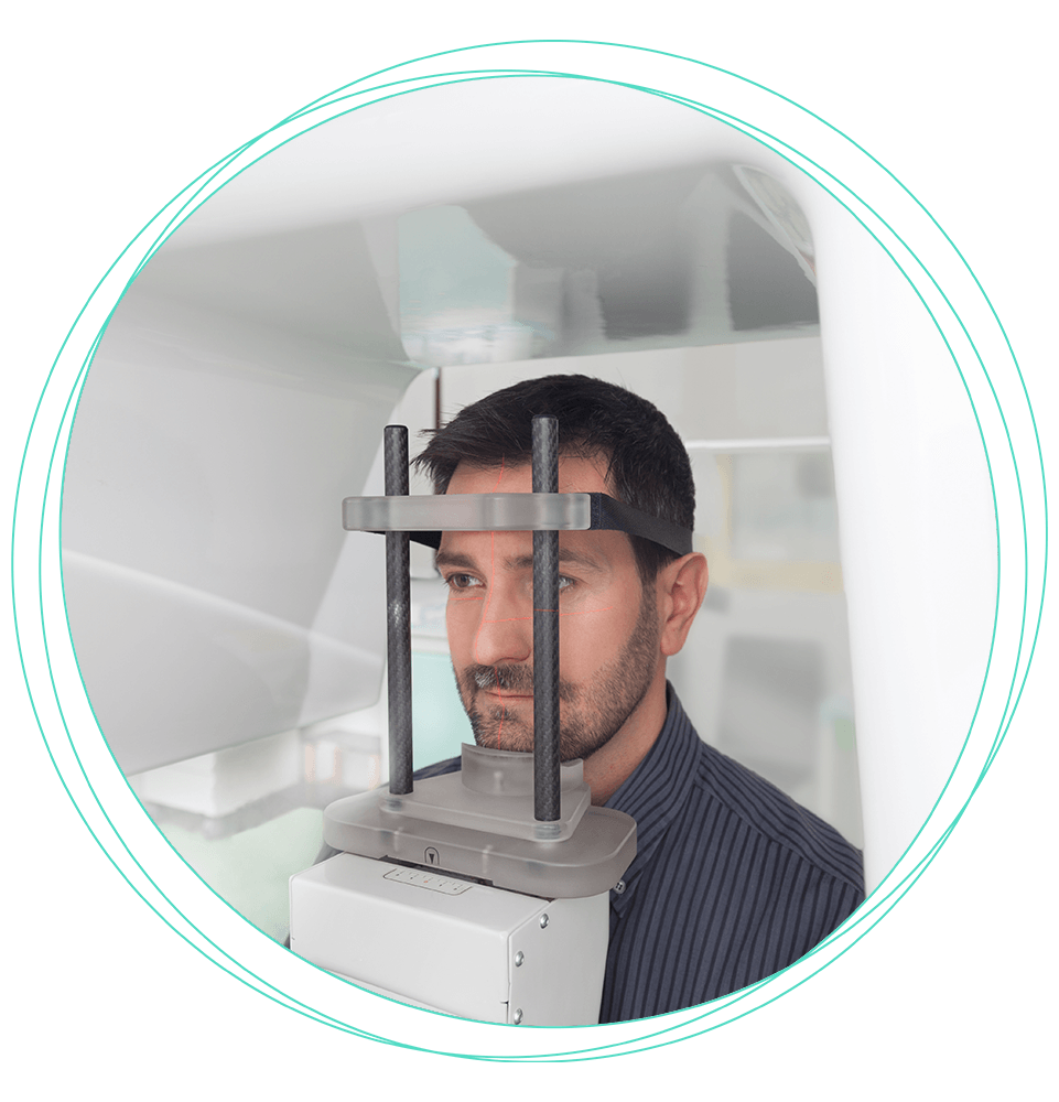 patient undergoing cbct scan for their dental treatment