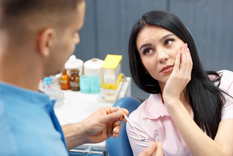 patient at the dental center with tooth pain