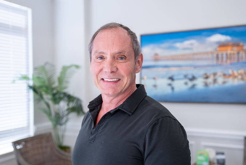patient Ken smiling who had invisalign